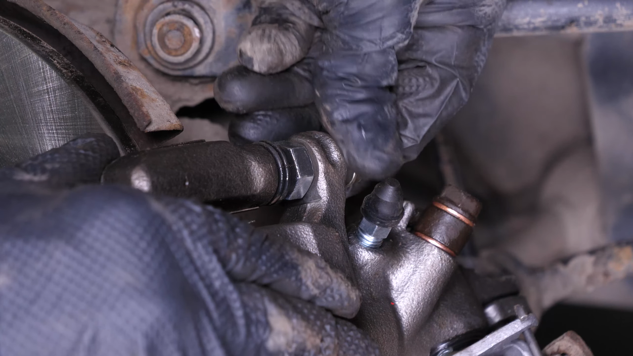 Put the brake caliper back