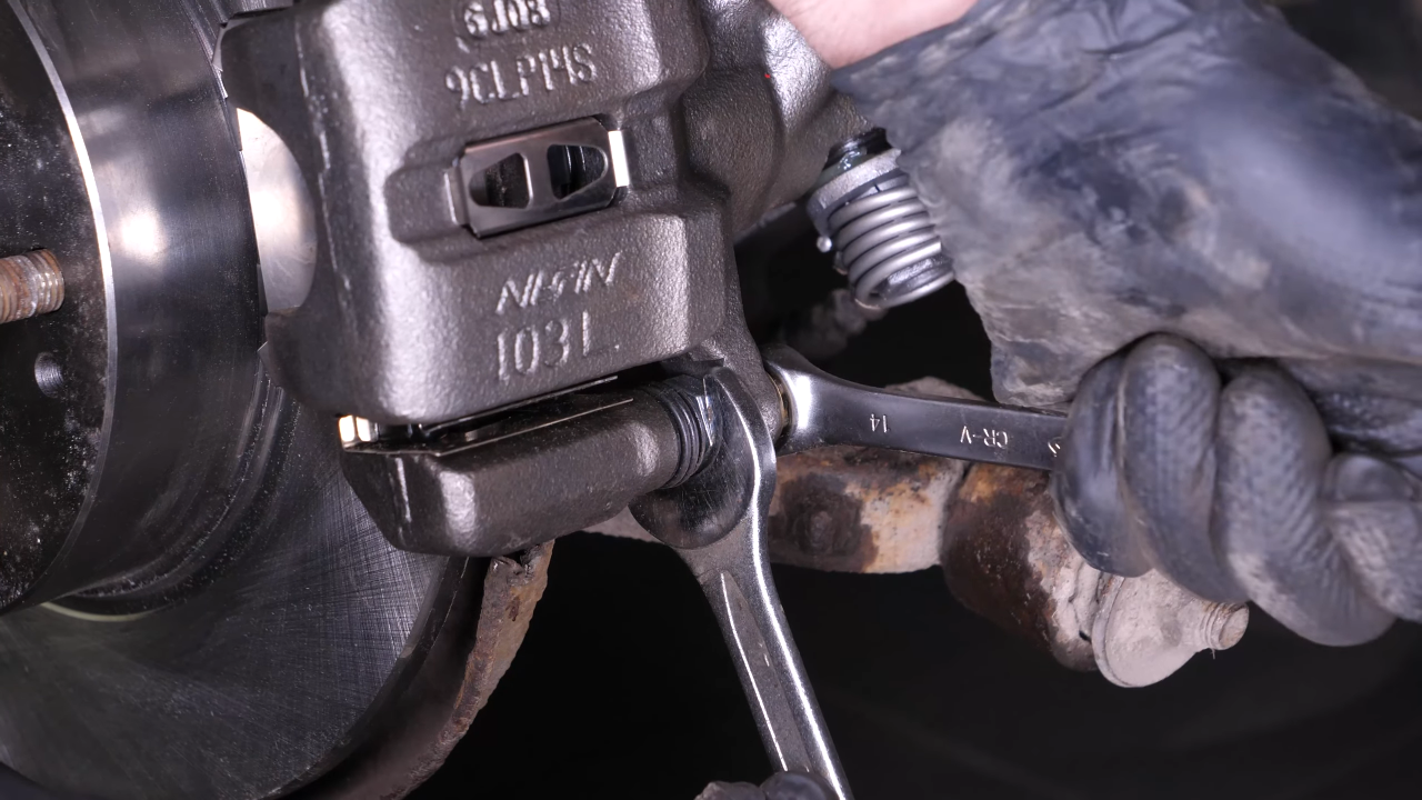 Put the brake caliper back