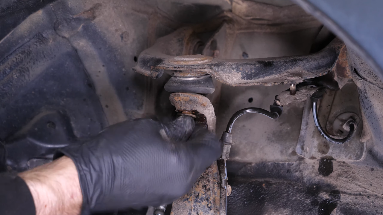 Remove the control arm ball joint