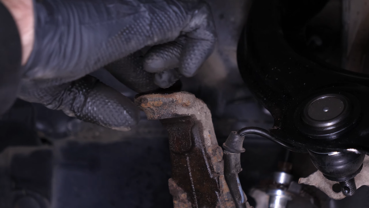 Put the control arm ball joint back