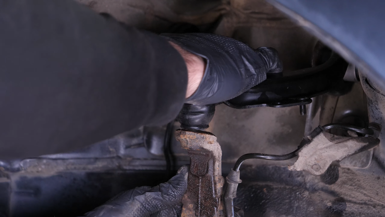 Put the control arm ball joint back