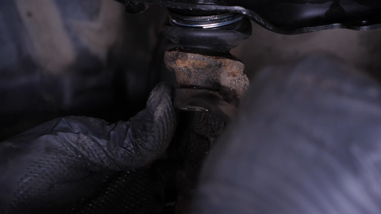 Put the control arm ball joint back