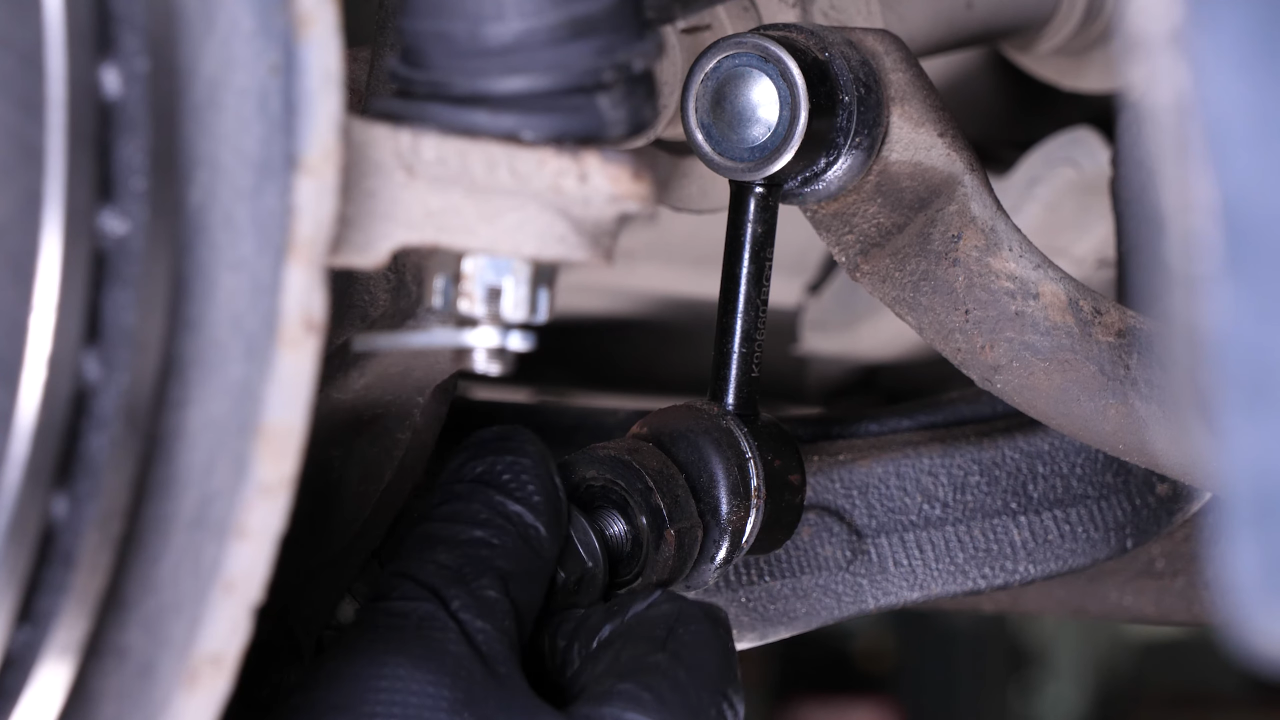 Disengage the sway bar end link