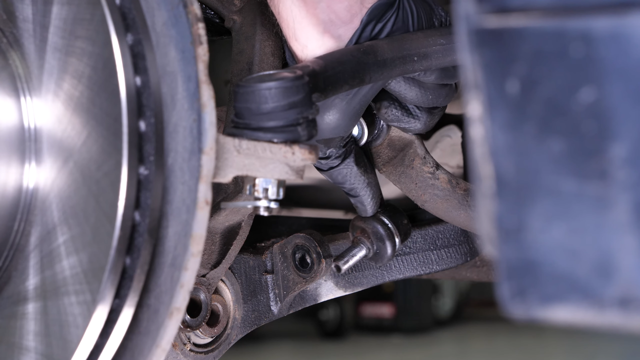 Disengage the sway bar end link