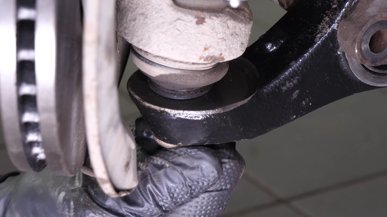 Put the control arm ball joint back