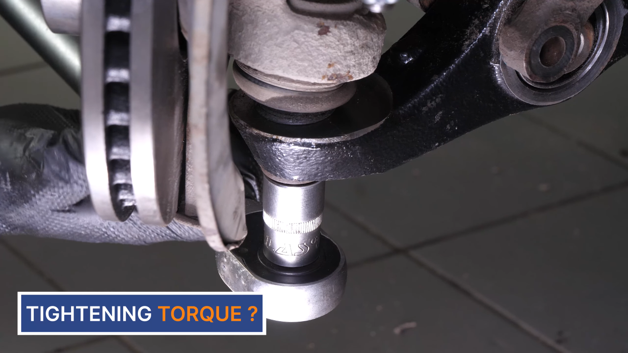 Put the control arm ball joint back