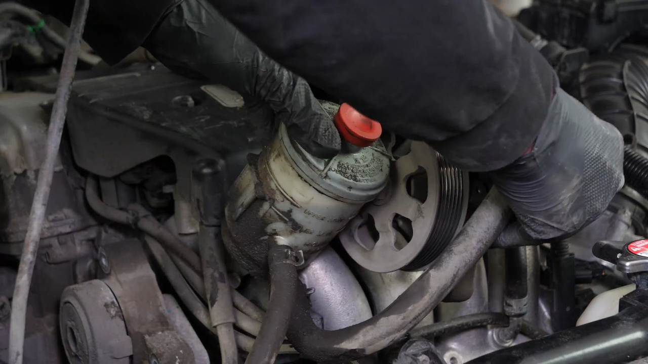 Remove the serpentine belt tensioner 