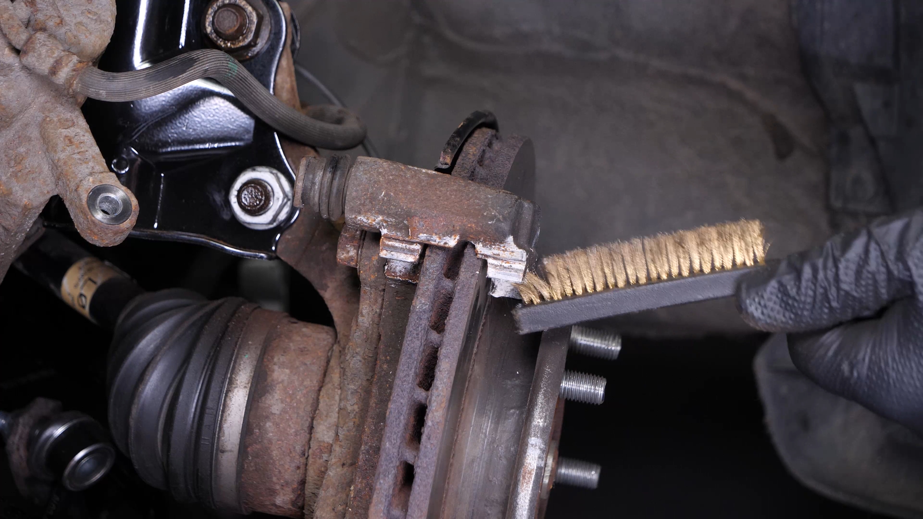 Clean the brake caliper mount