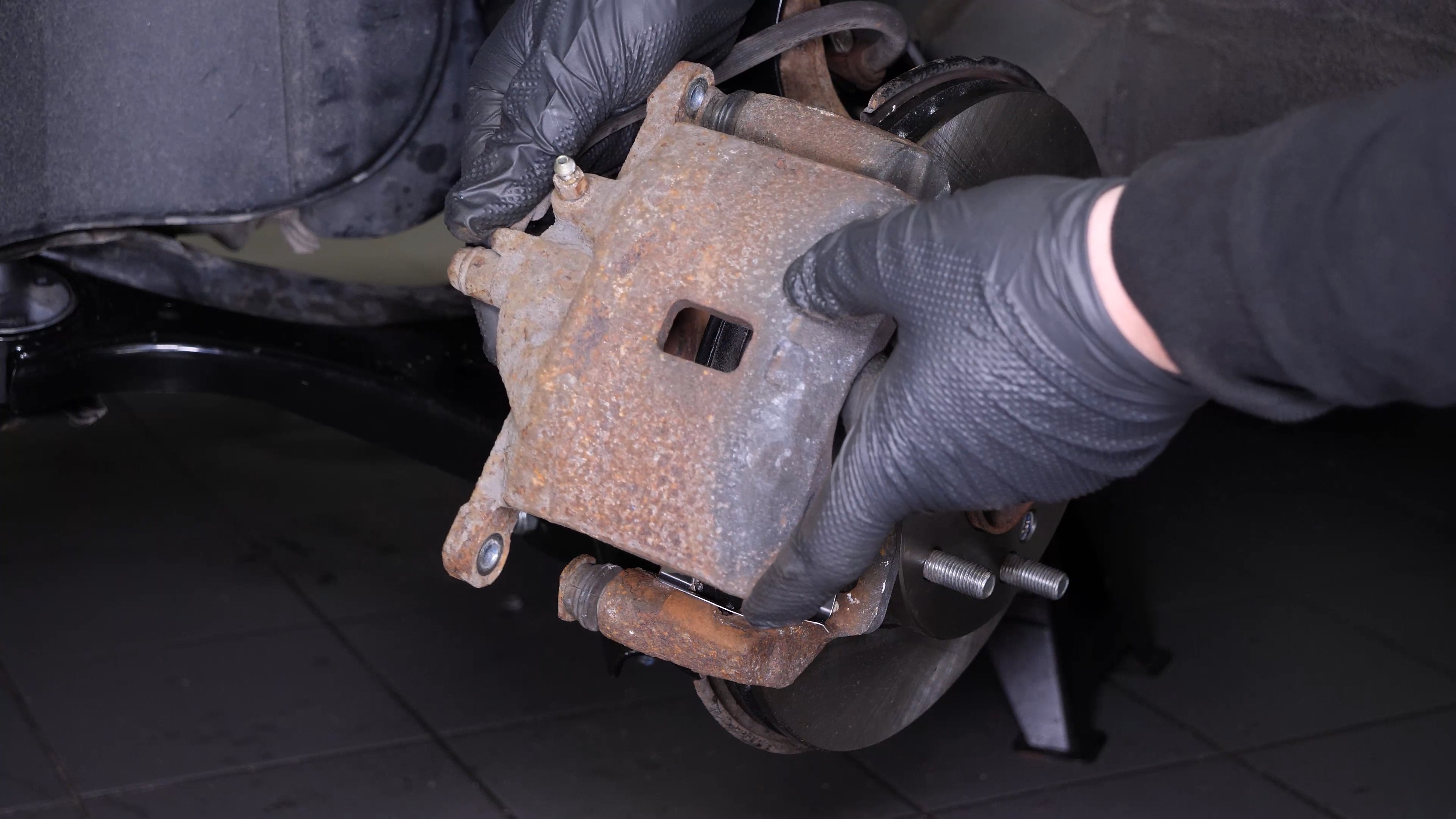 Put the brake caliper back