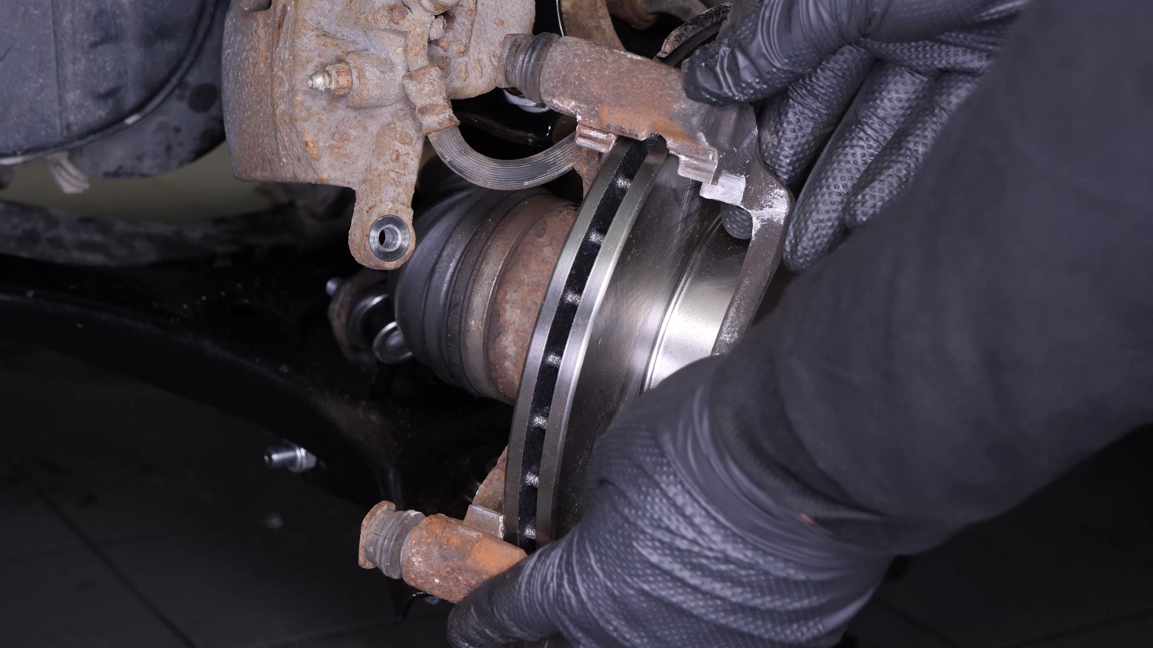 Put the brake caliper mount back on
