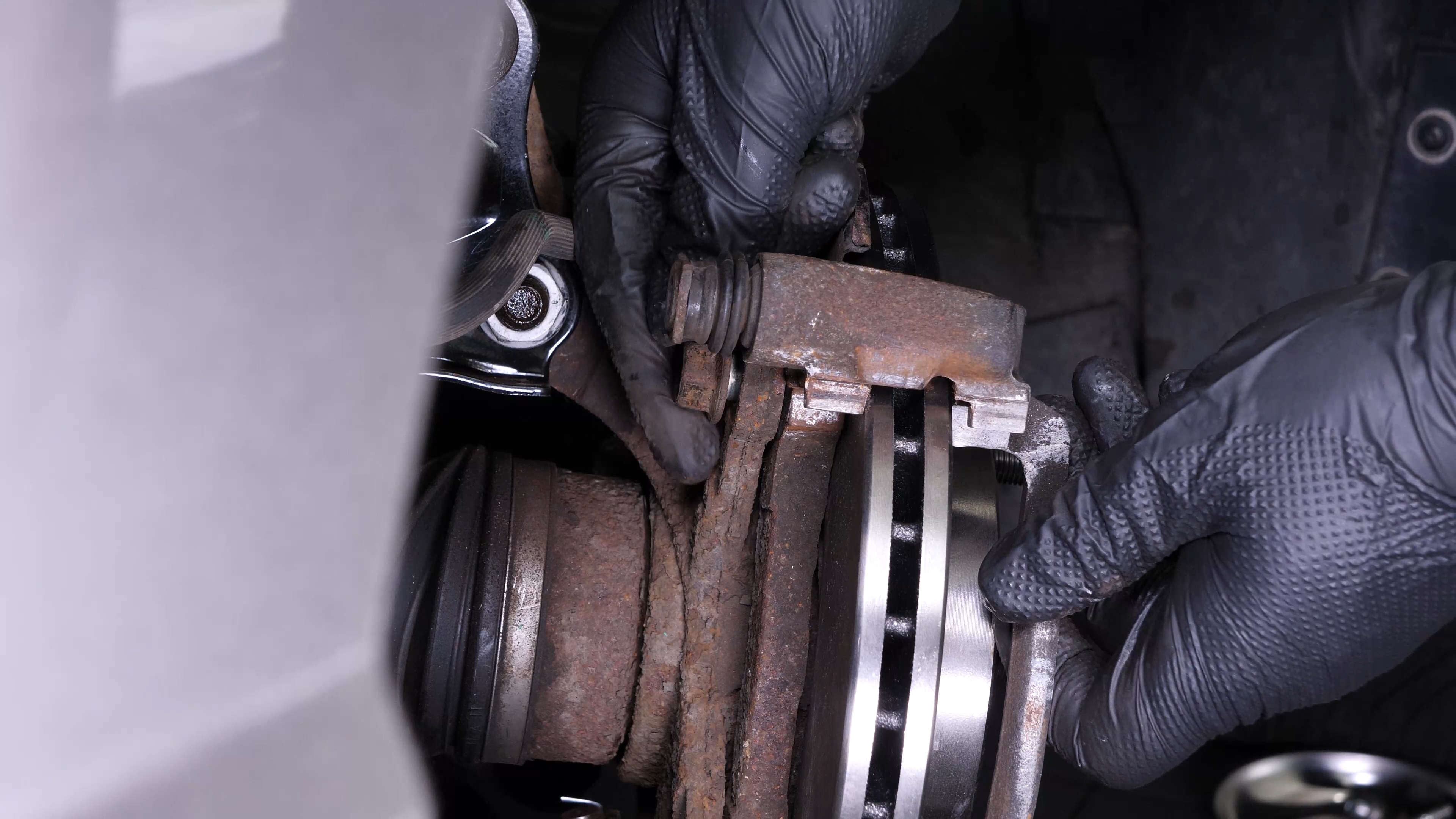 Put the brake caliper mount back on