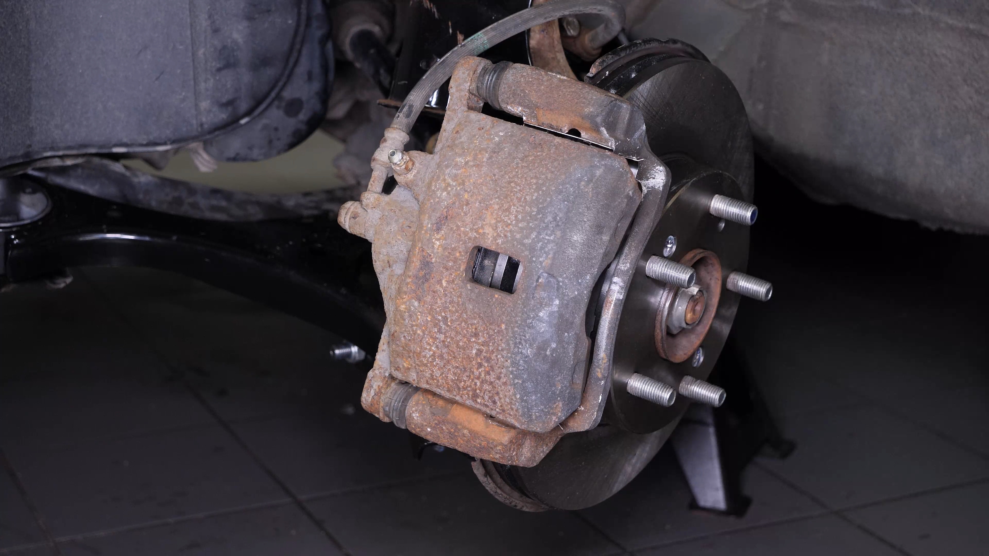 Put the brake caliper back
