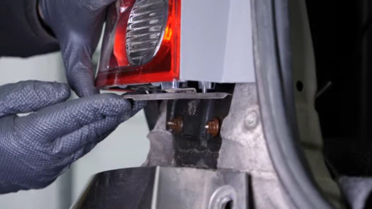 Put the tail light housing back