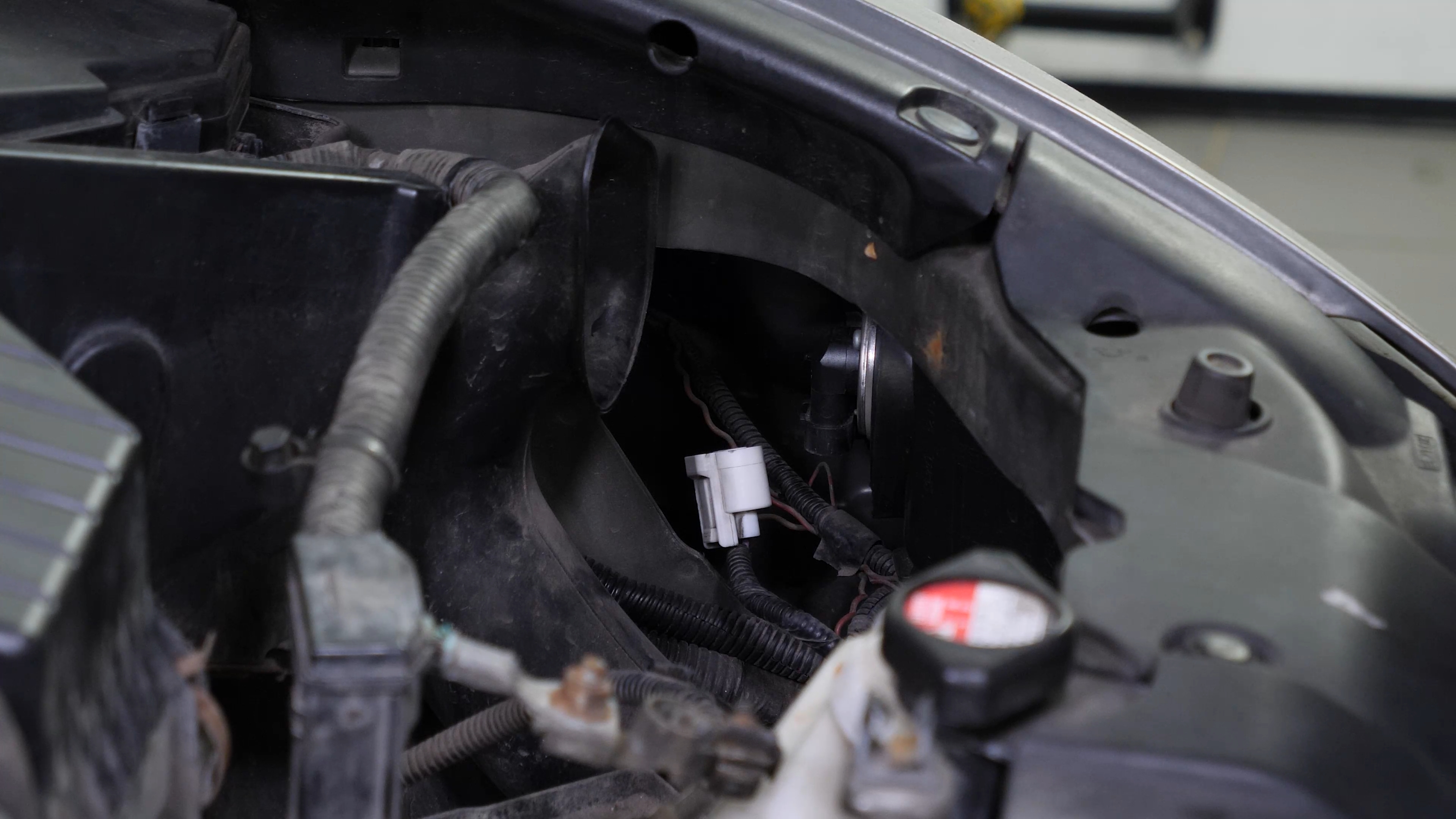 Replace the low beam bulb
