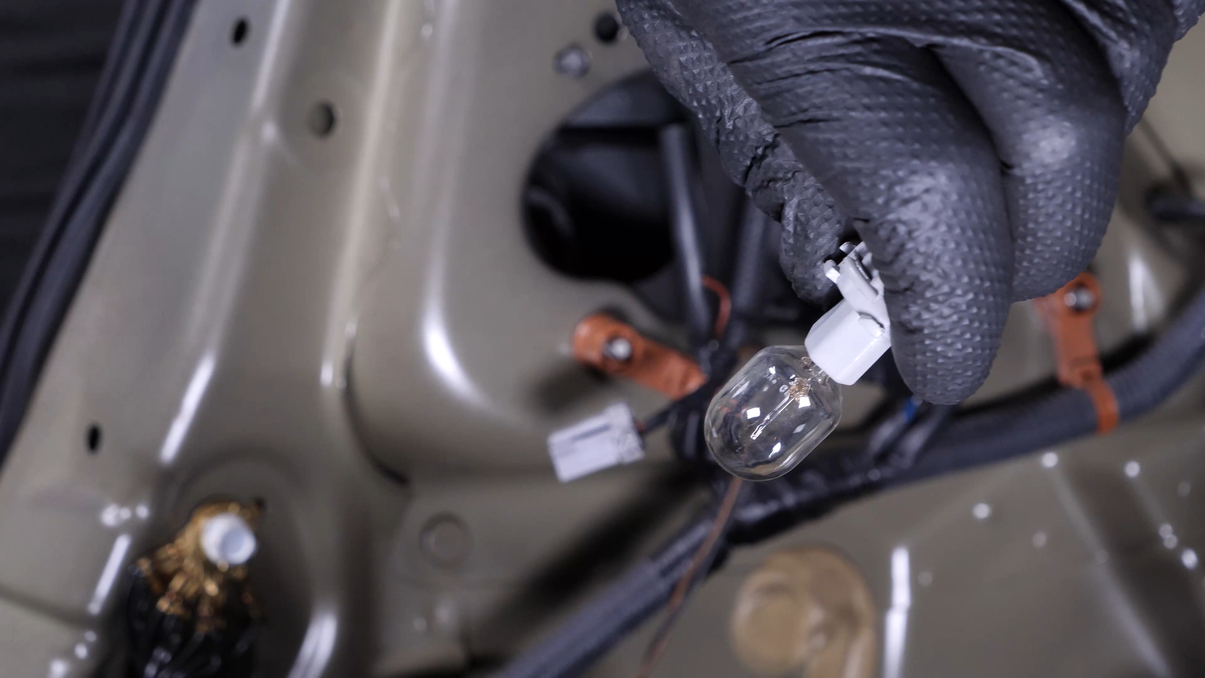 Replace the reverse light bulb