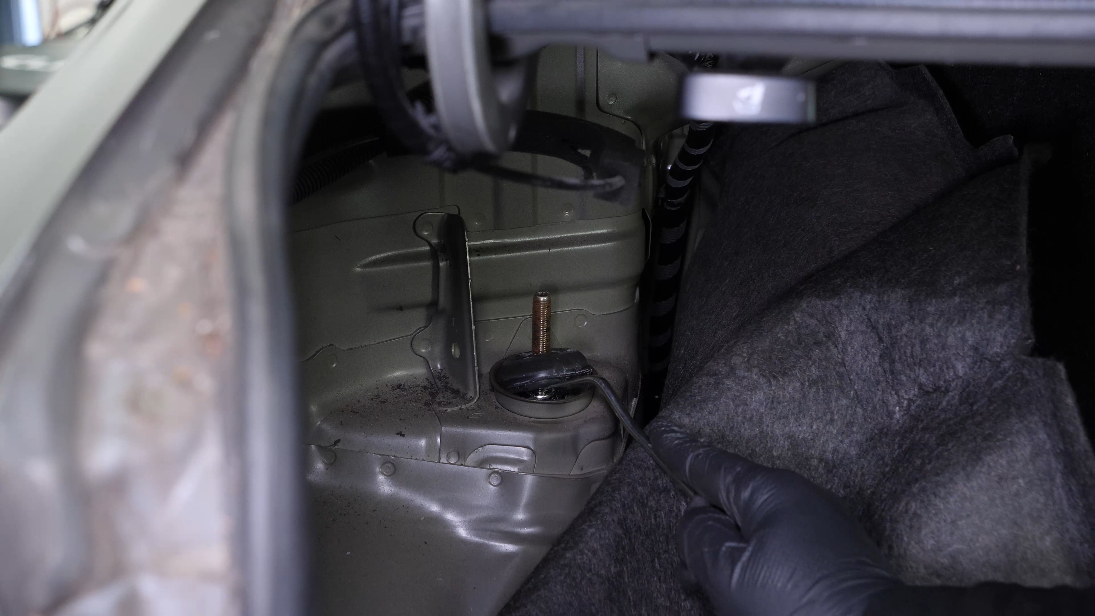 Unscrew the shock mount bearing nut