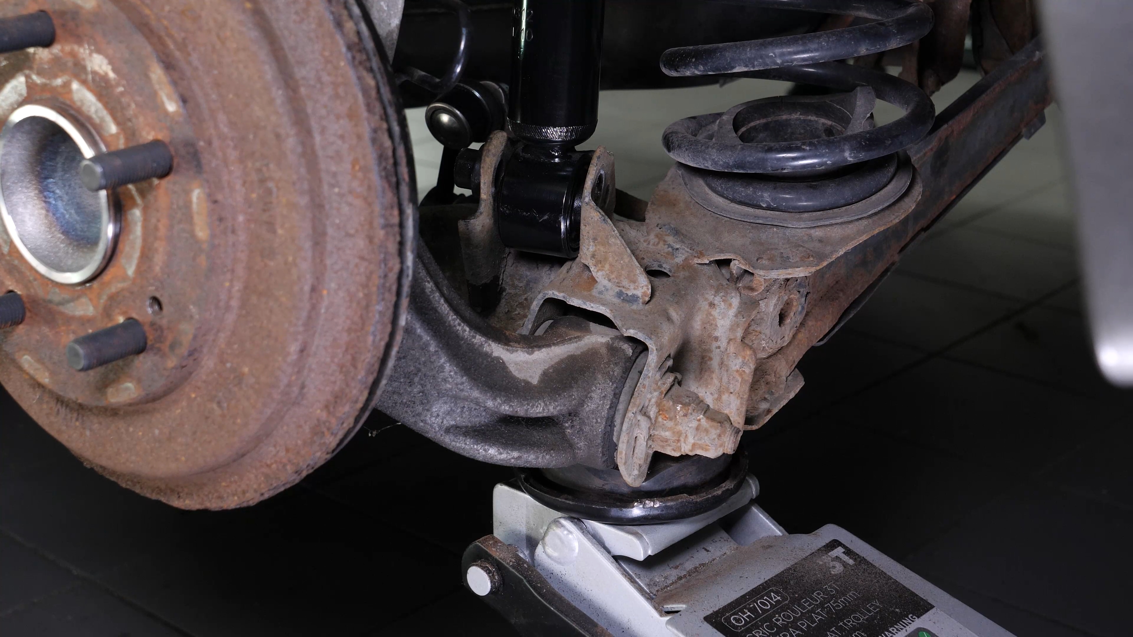 Install the new shock absorber