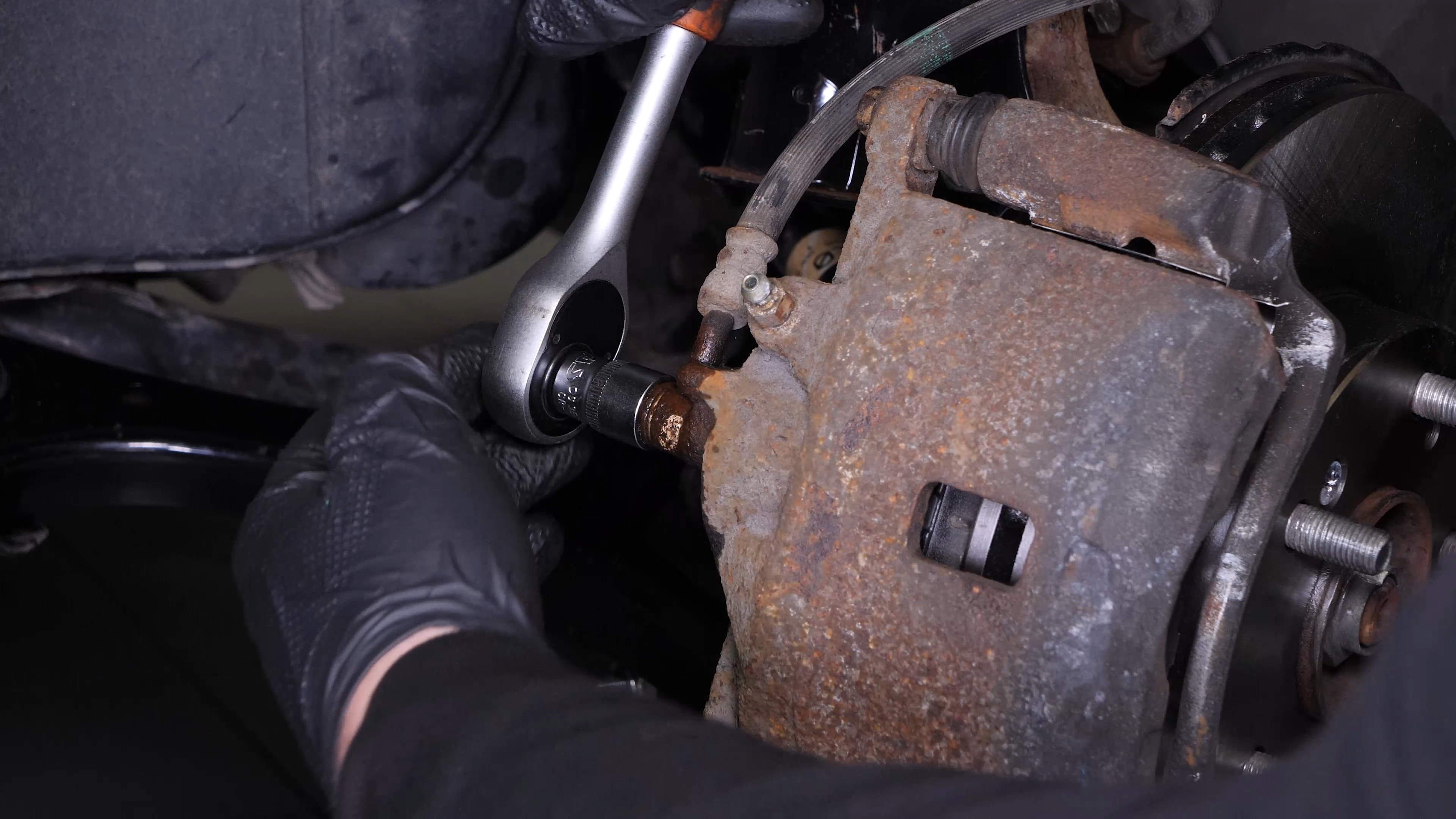 Unscrew the brake hose from the brake caliper