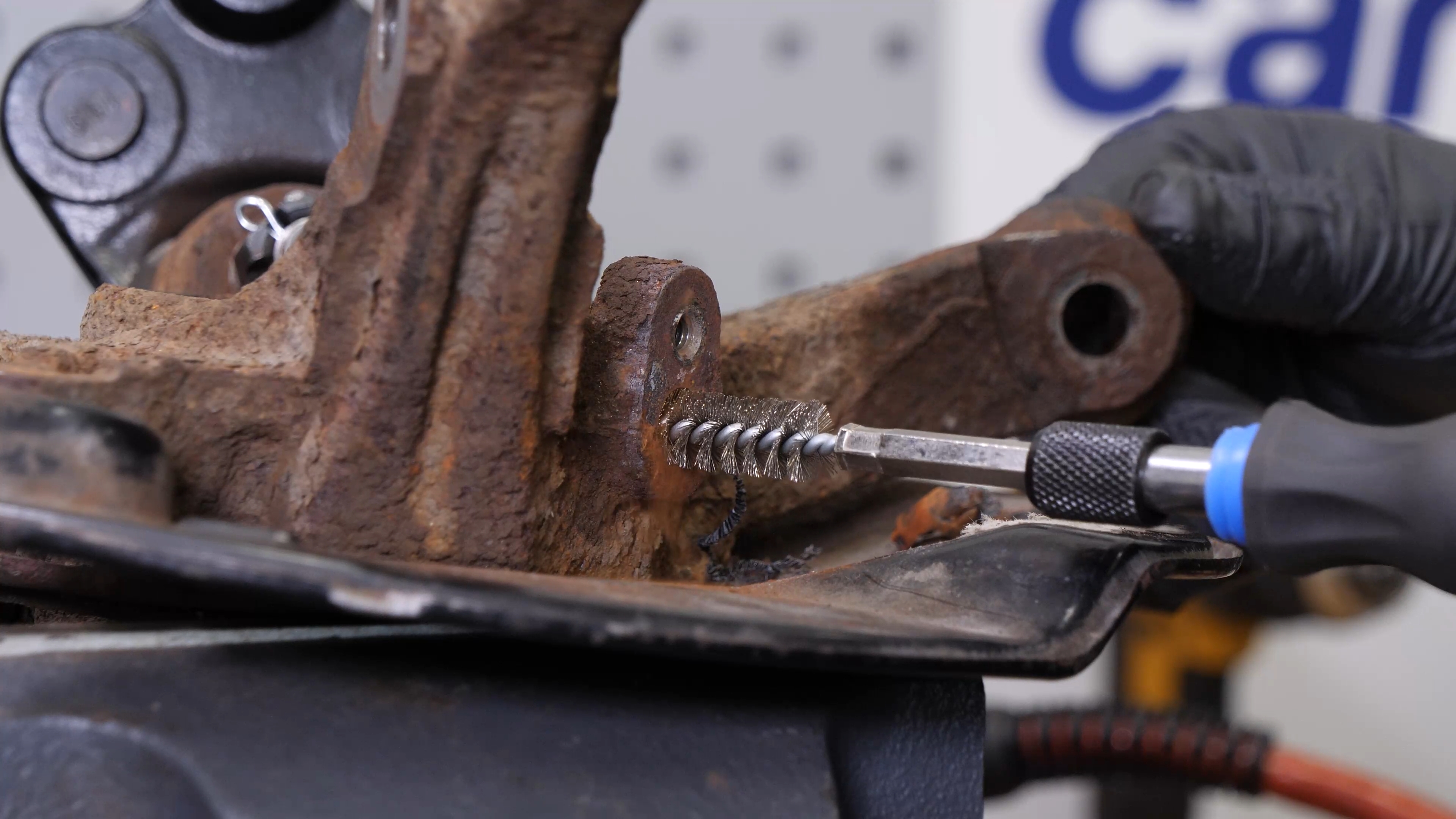 Remove the ABS sensor from the wheel knuckle