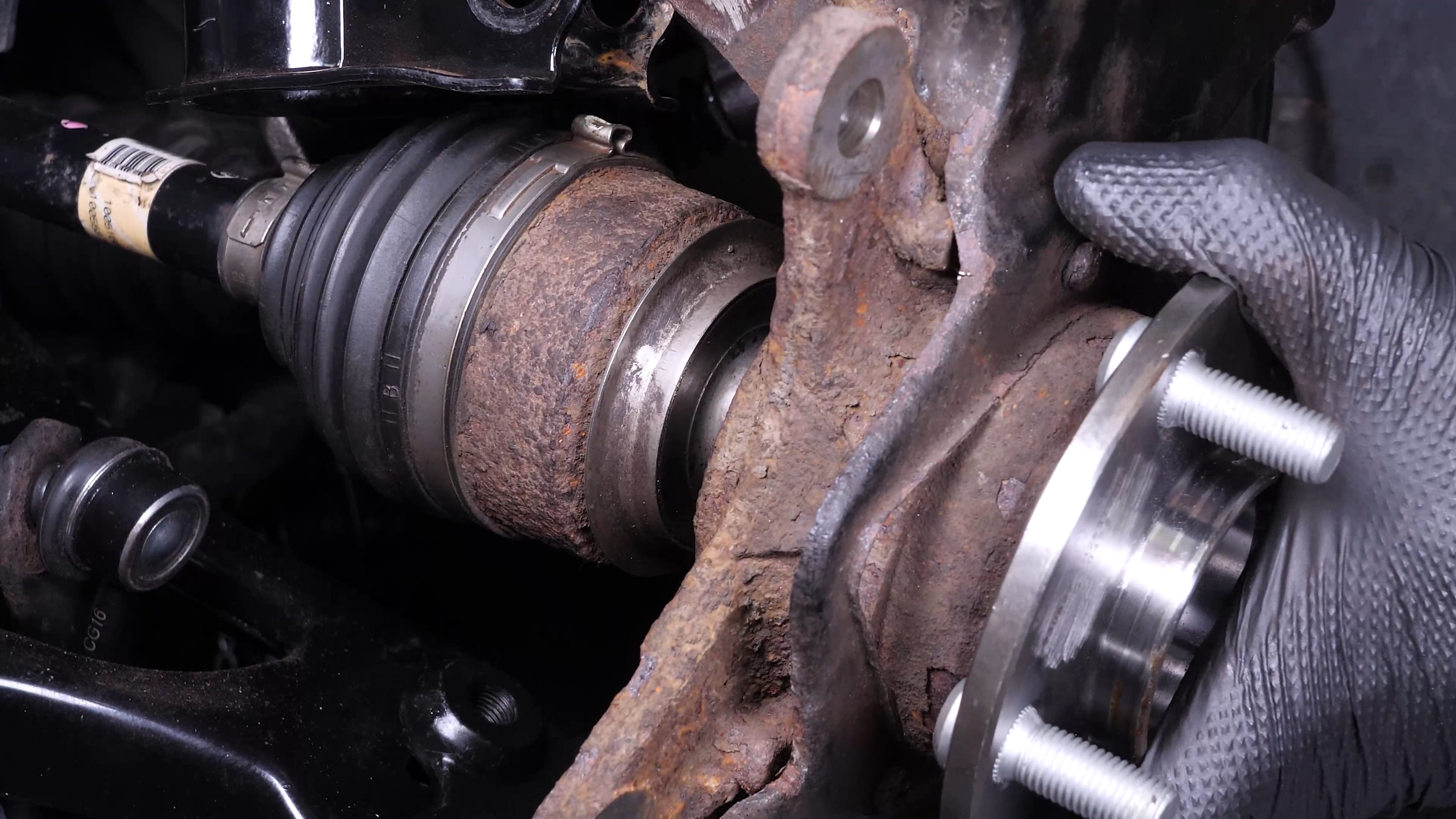 Remove the ABS sensor from the wheel knuckle