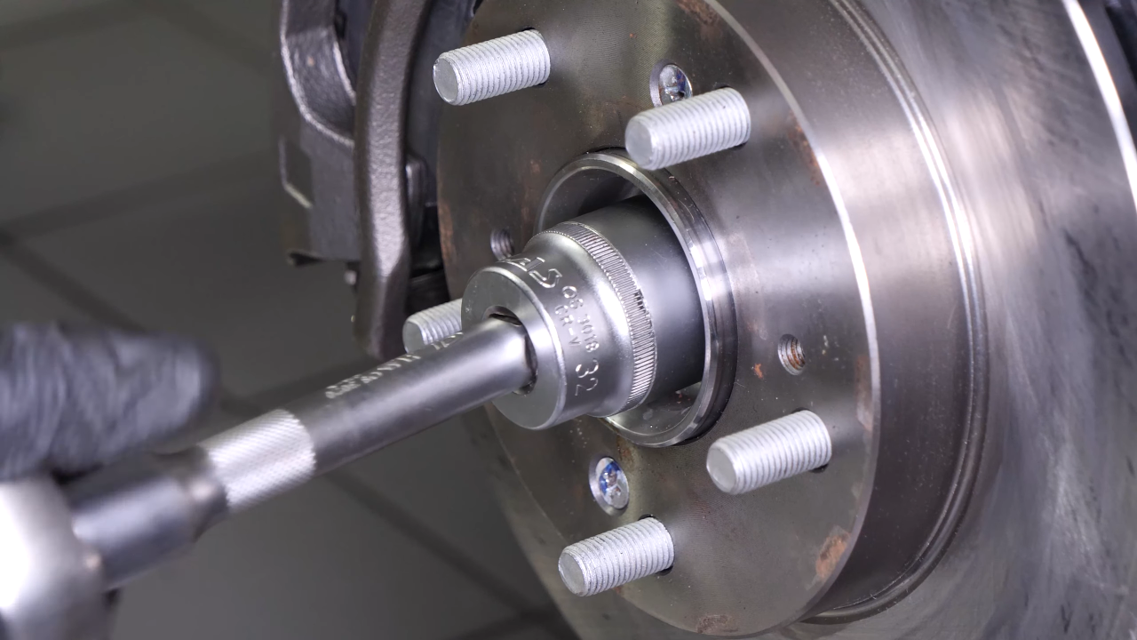 Remove the wheel knuckle