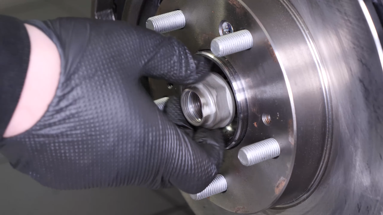Remove the wheel knuckle