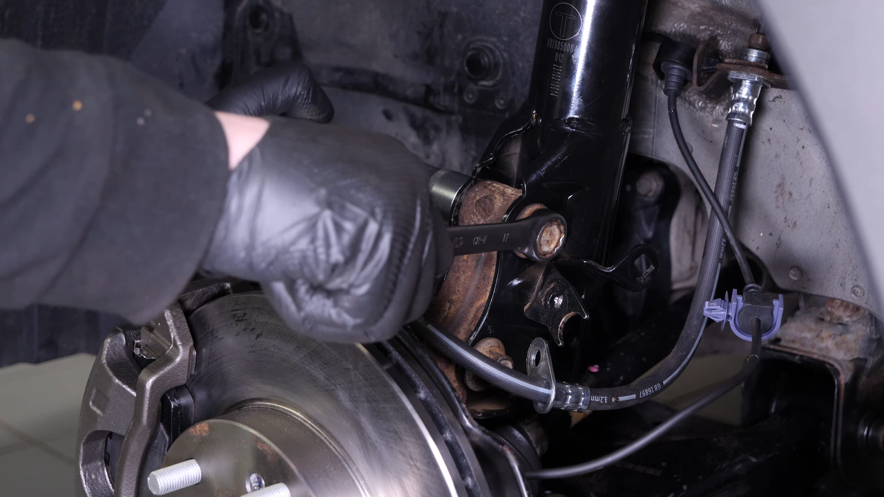 Remove the wheel knuckle