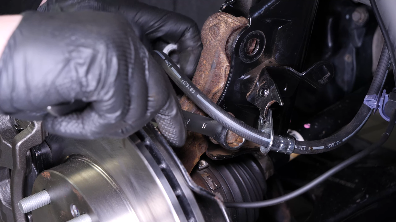 Remove the wheel knuckle