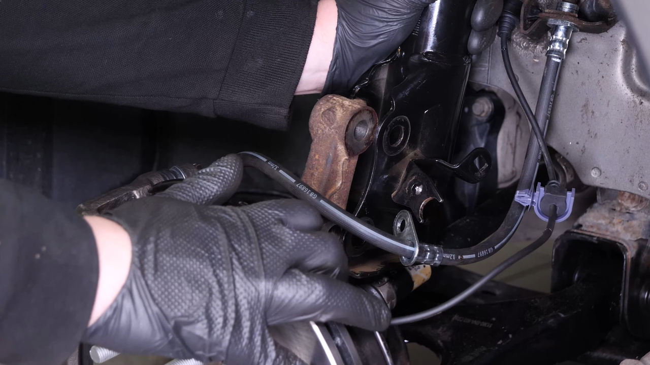 Remove the wheel knuckle
