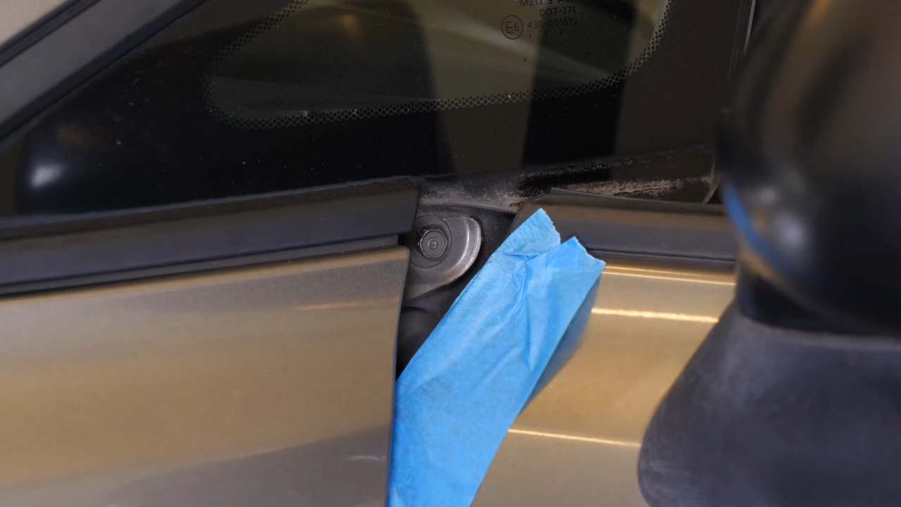 Unscrew the screw inside the door