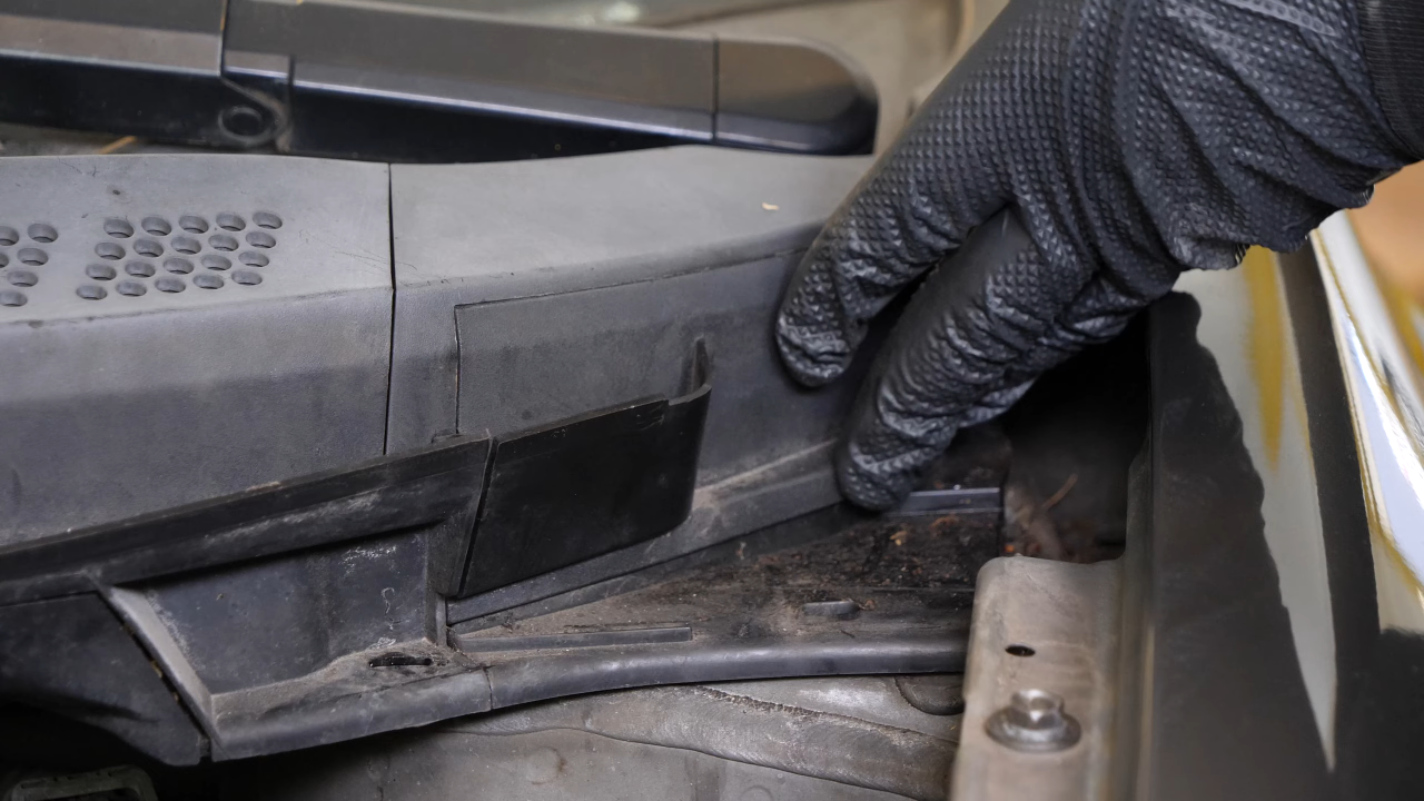 Screw back the bolts along the hood