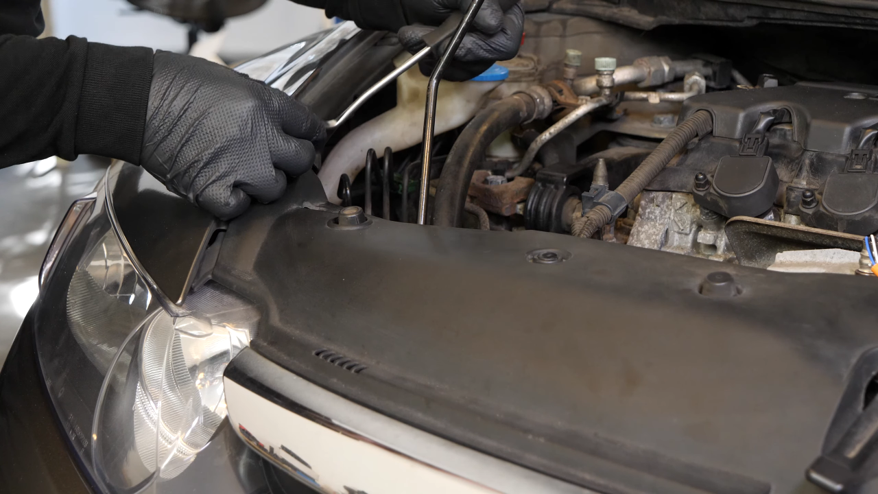 Remove the radiator support cover