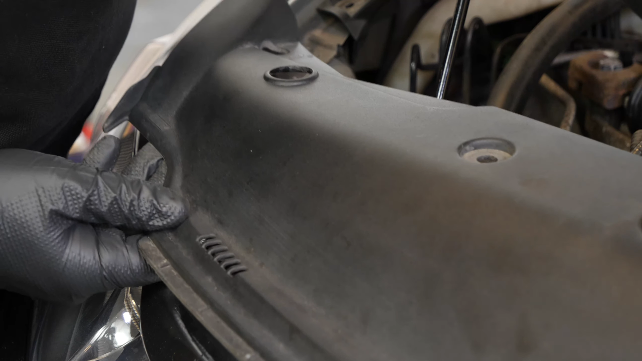 Remove the radiator support cover