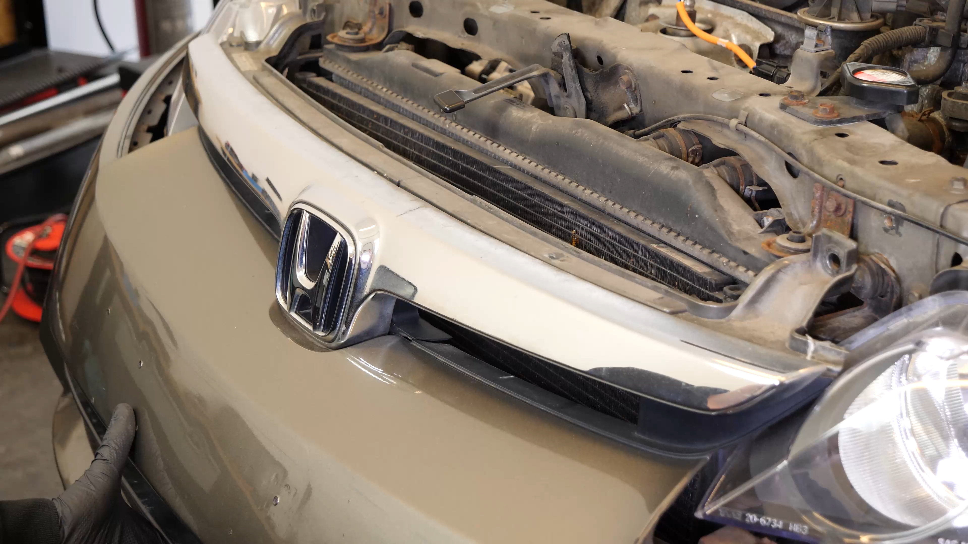 Put the bumper cover back