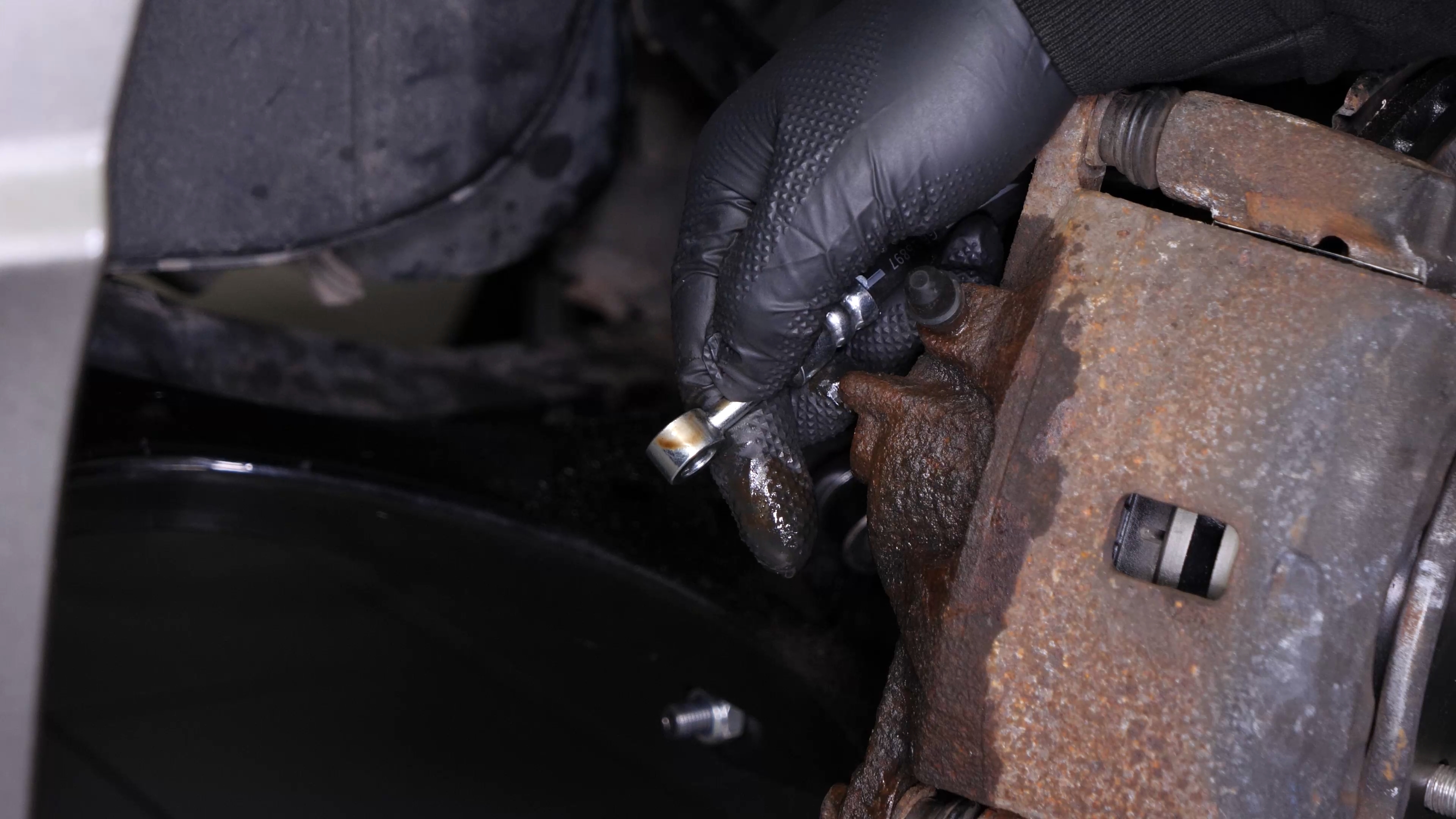 Unscrew the brake hose from the caliper