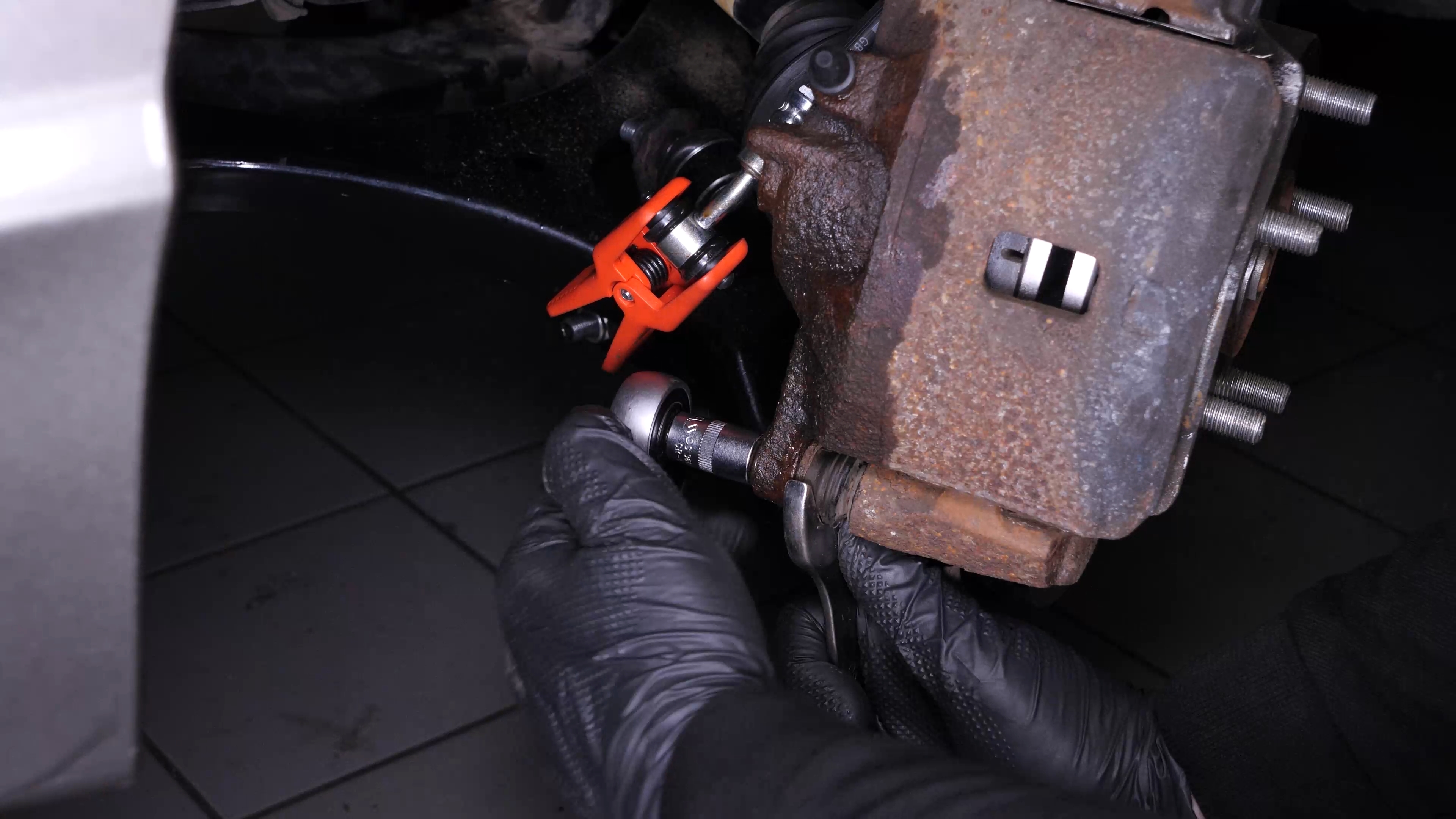 Remove the brake caliper