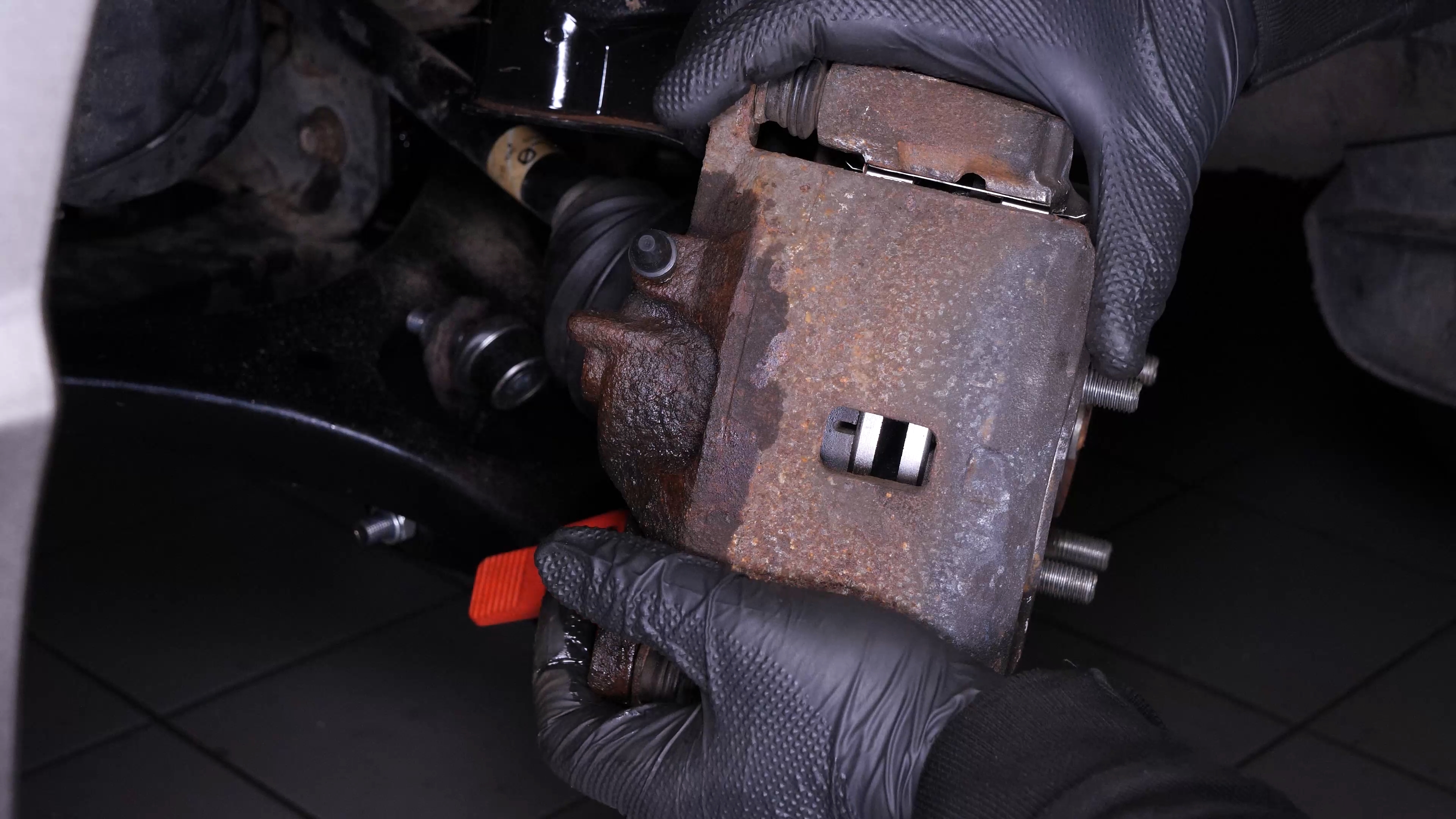Remove the brake caliper