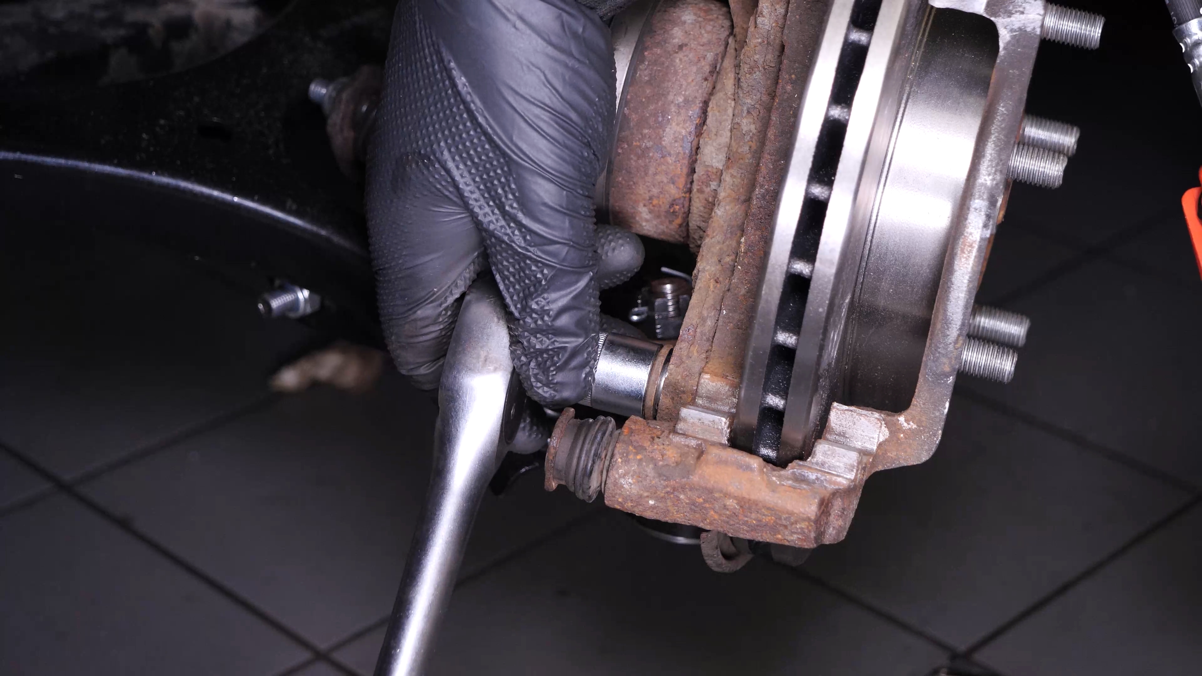 Remove the  brake caliper mount