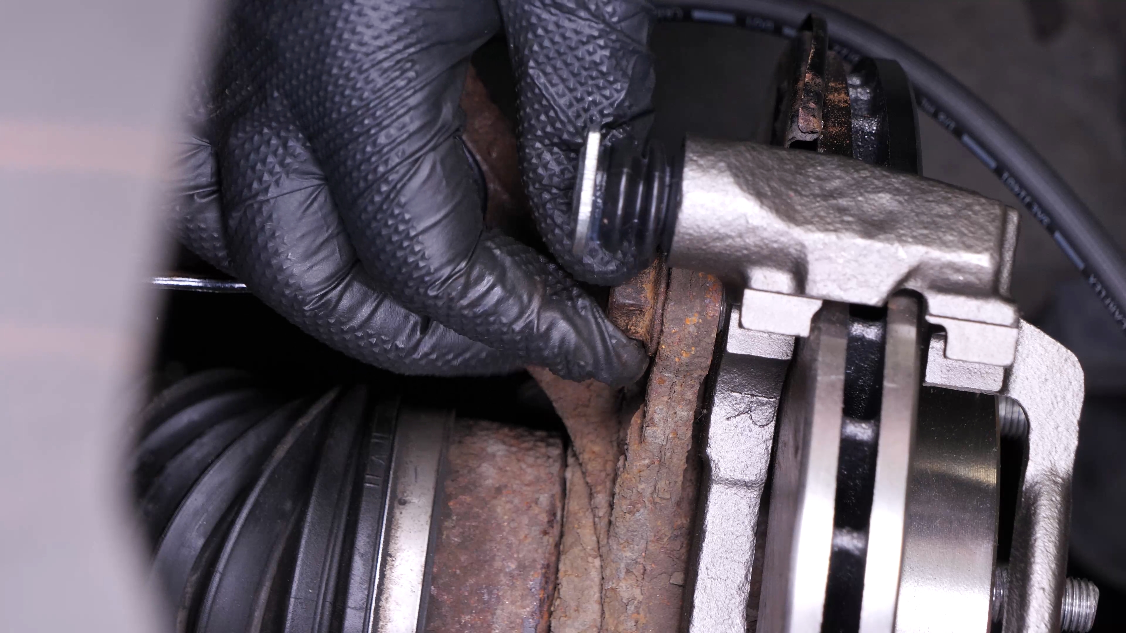 Put the brake caliper mount back on