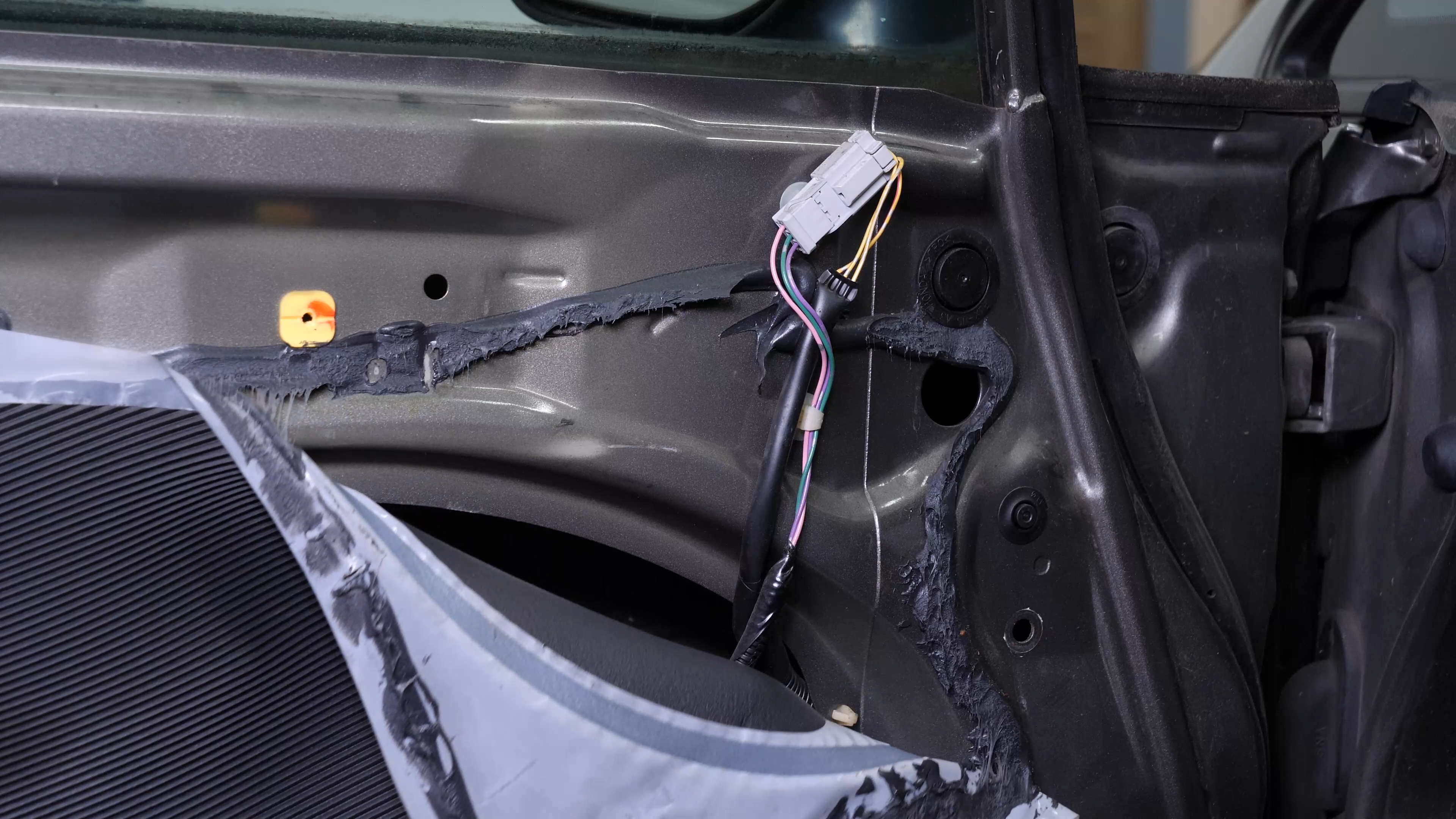 Disconnect the side view mirror connector