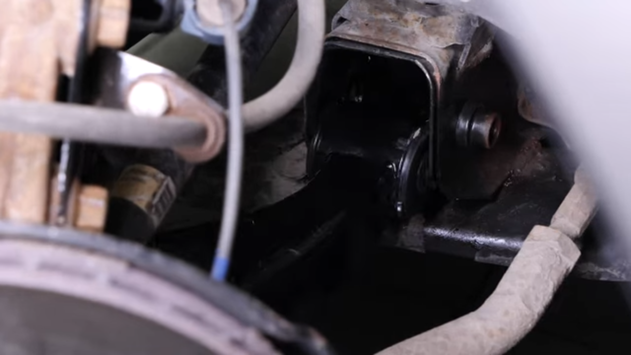 Put the control arm back