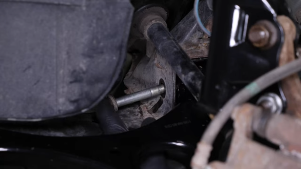 Put the control arm back