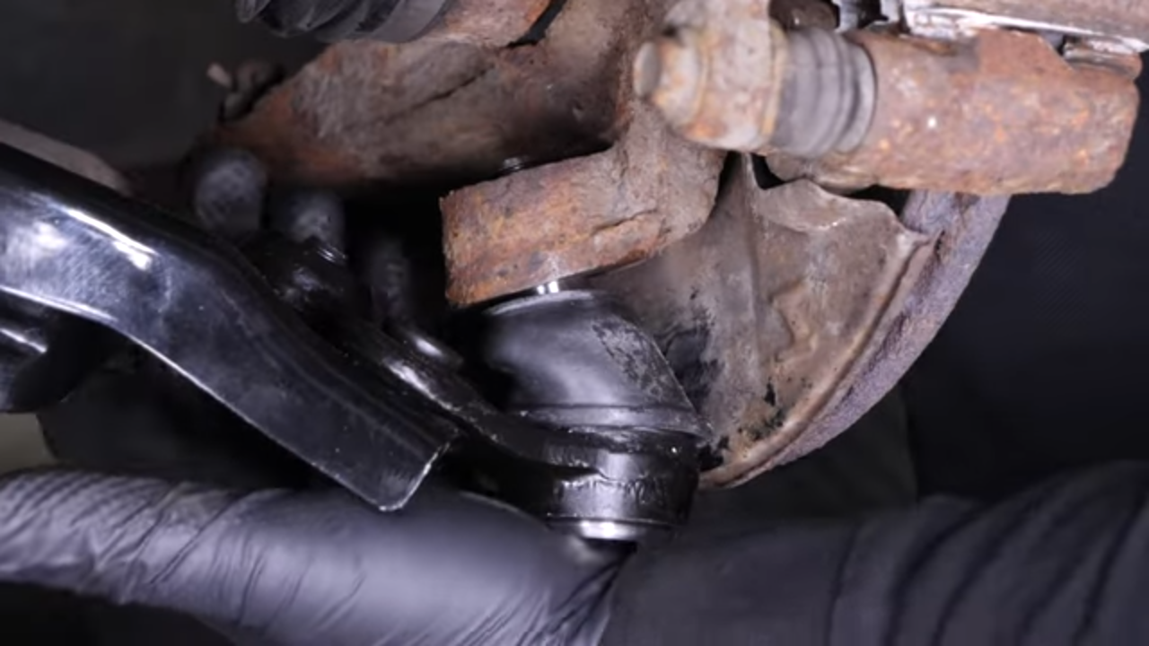 Put the control arm ball joint back