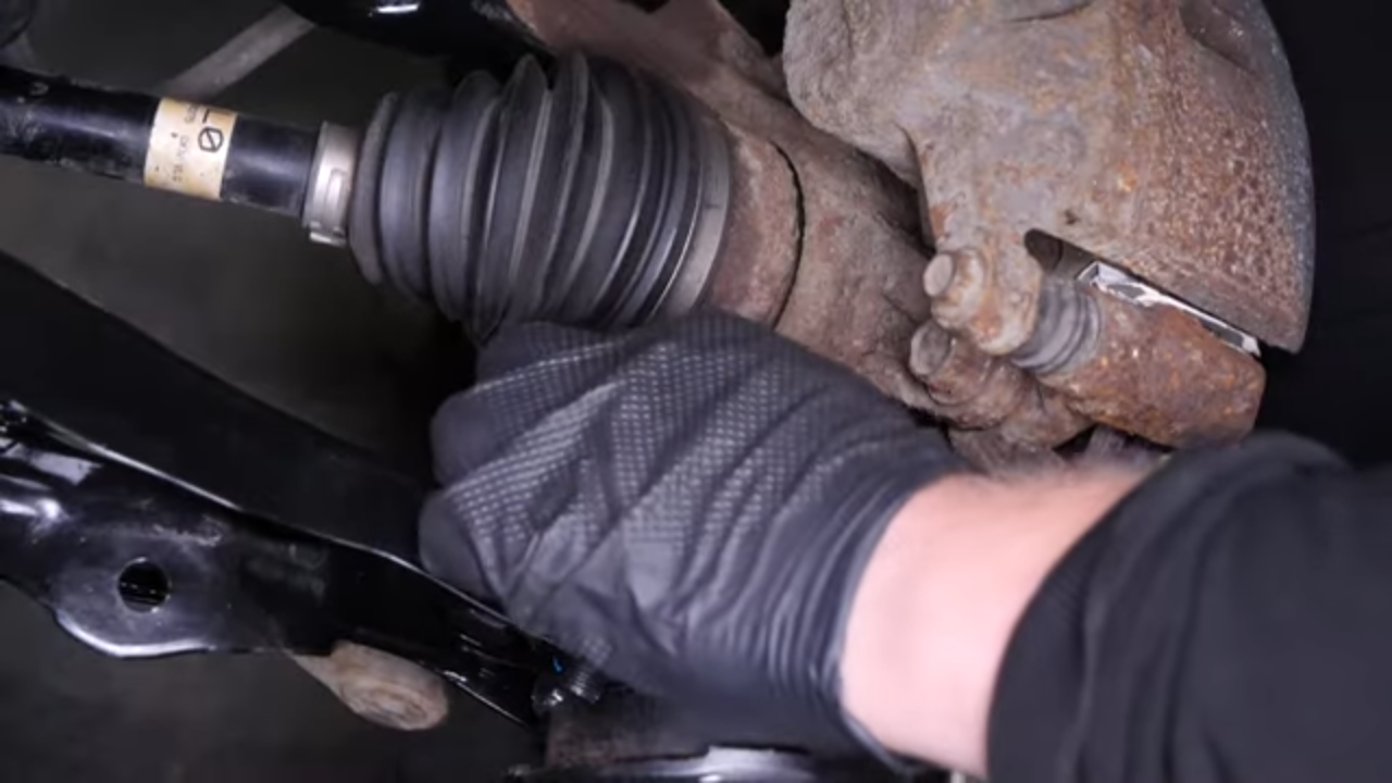 Put the control arm ball joint back