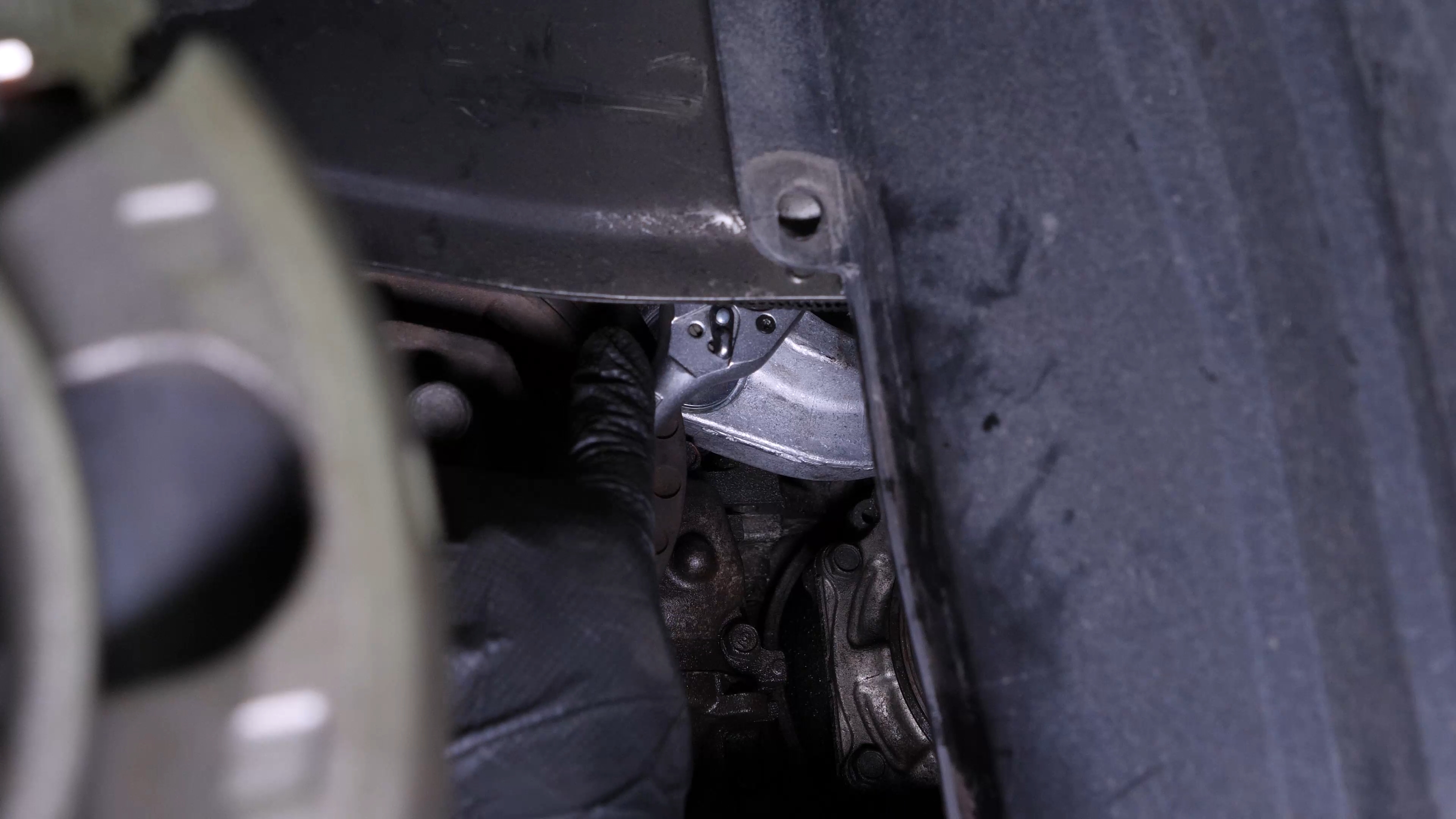 Put the belt tensioner back