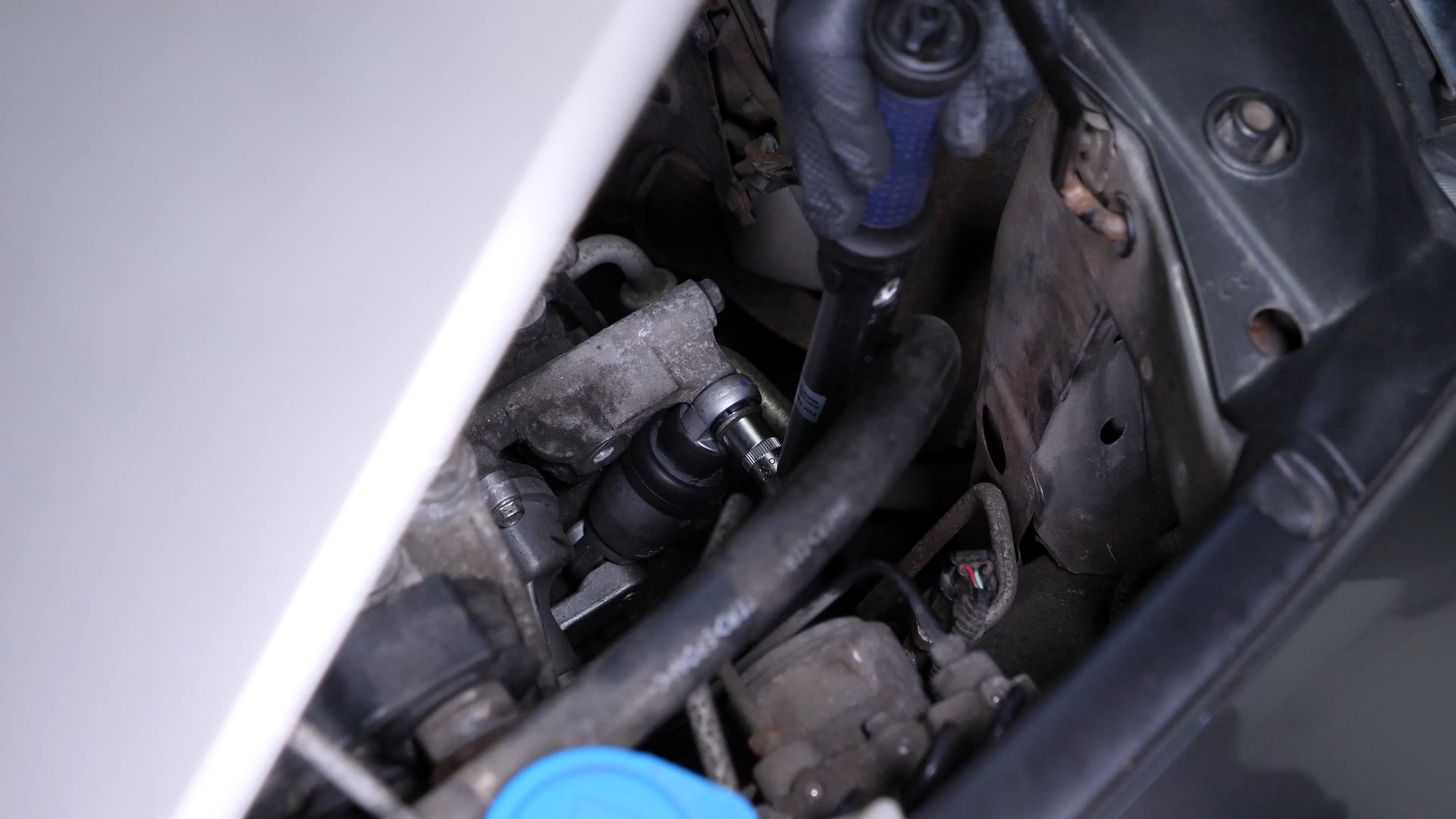 Put the belt tensioner back