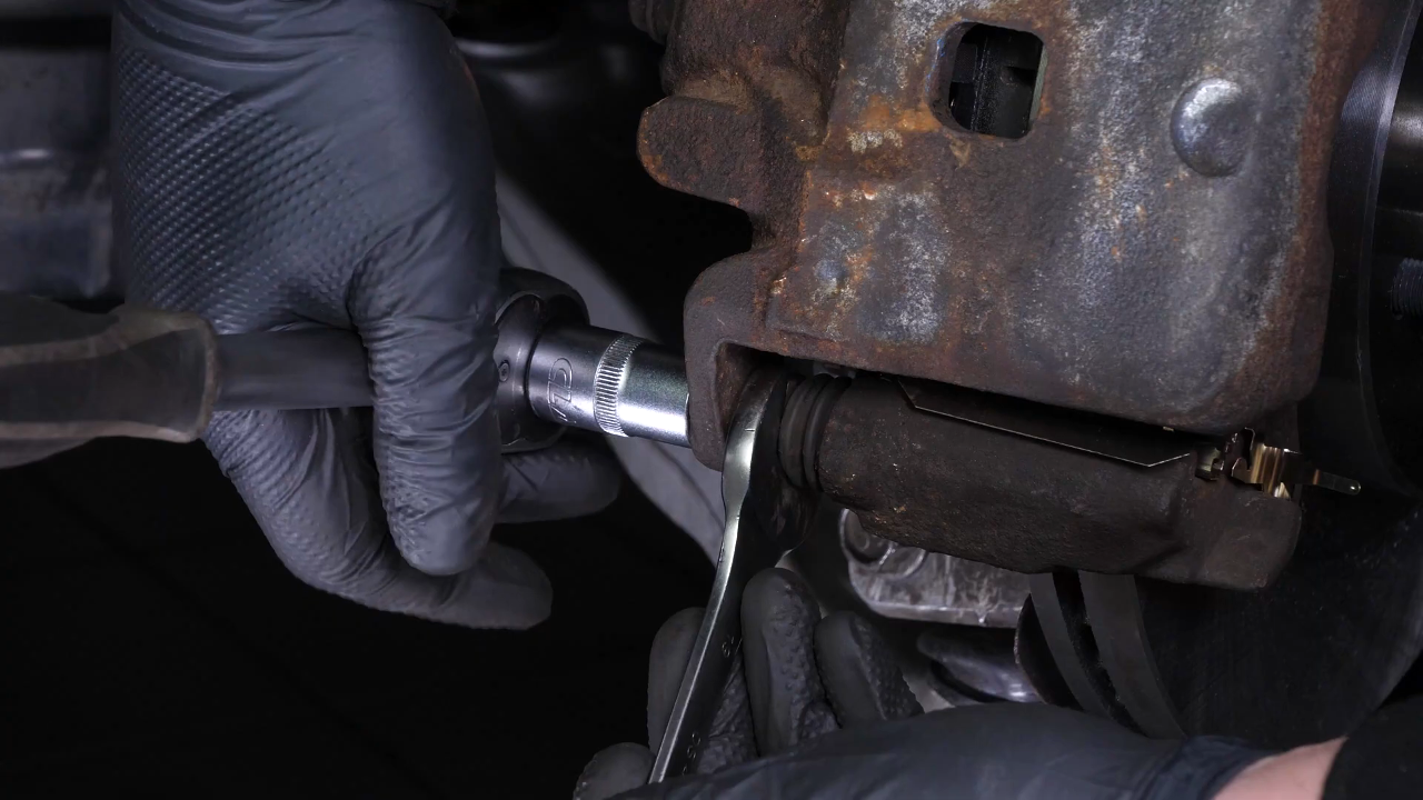 Put the brake caliper back