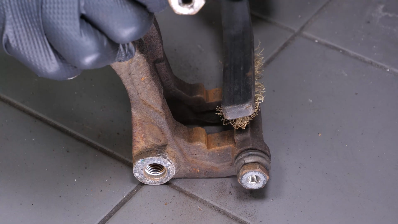Clean the brake caliper mount
