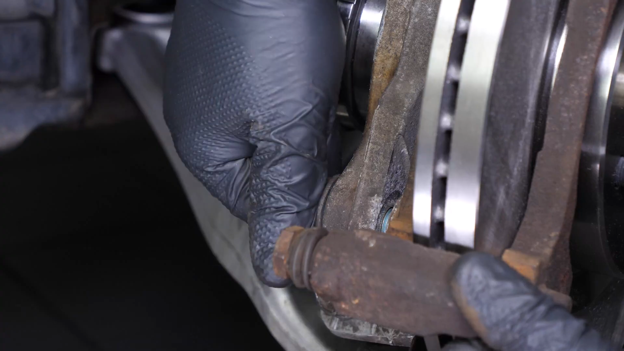 Put the brake caliper mount back on