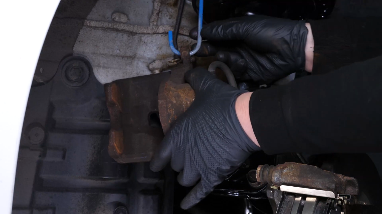 Put the brake caliper back